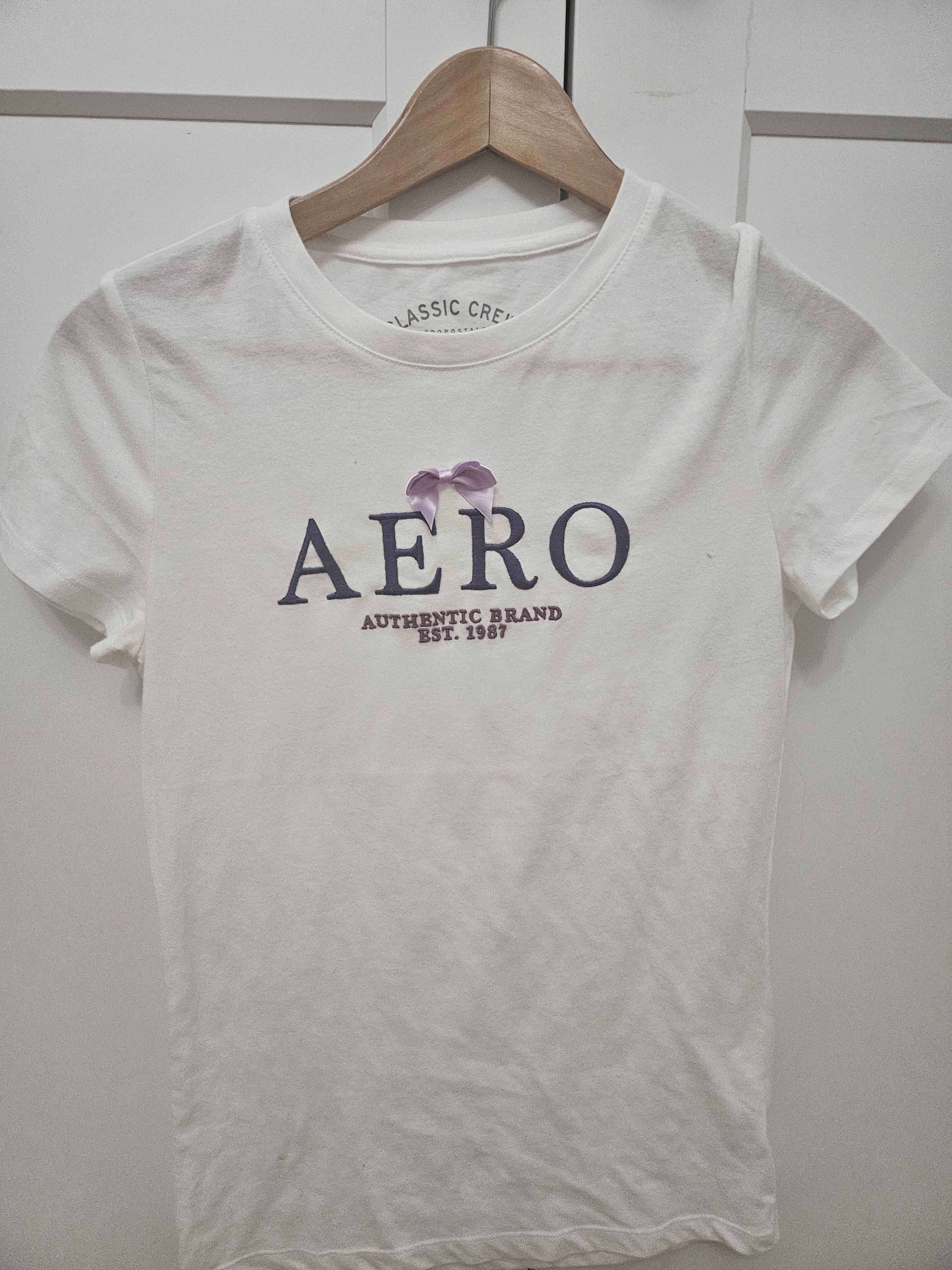 Aeropostale White Tee With Navy Logo And Light Purple Bow